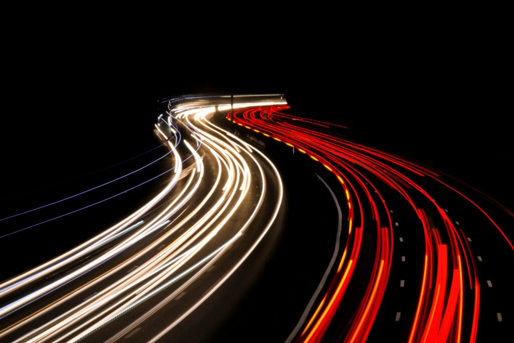 Highway traffic light trails at night — SkyToll central monitoring